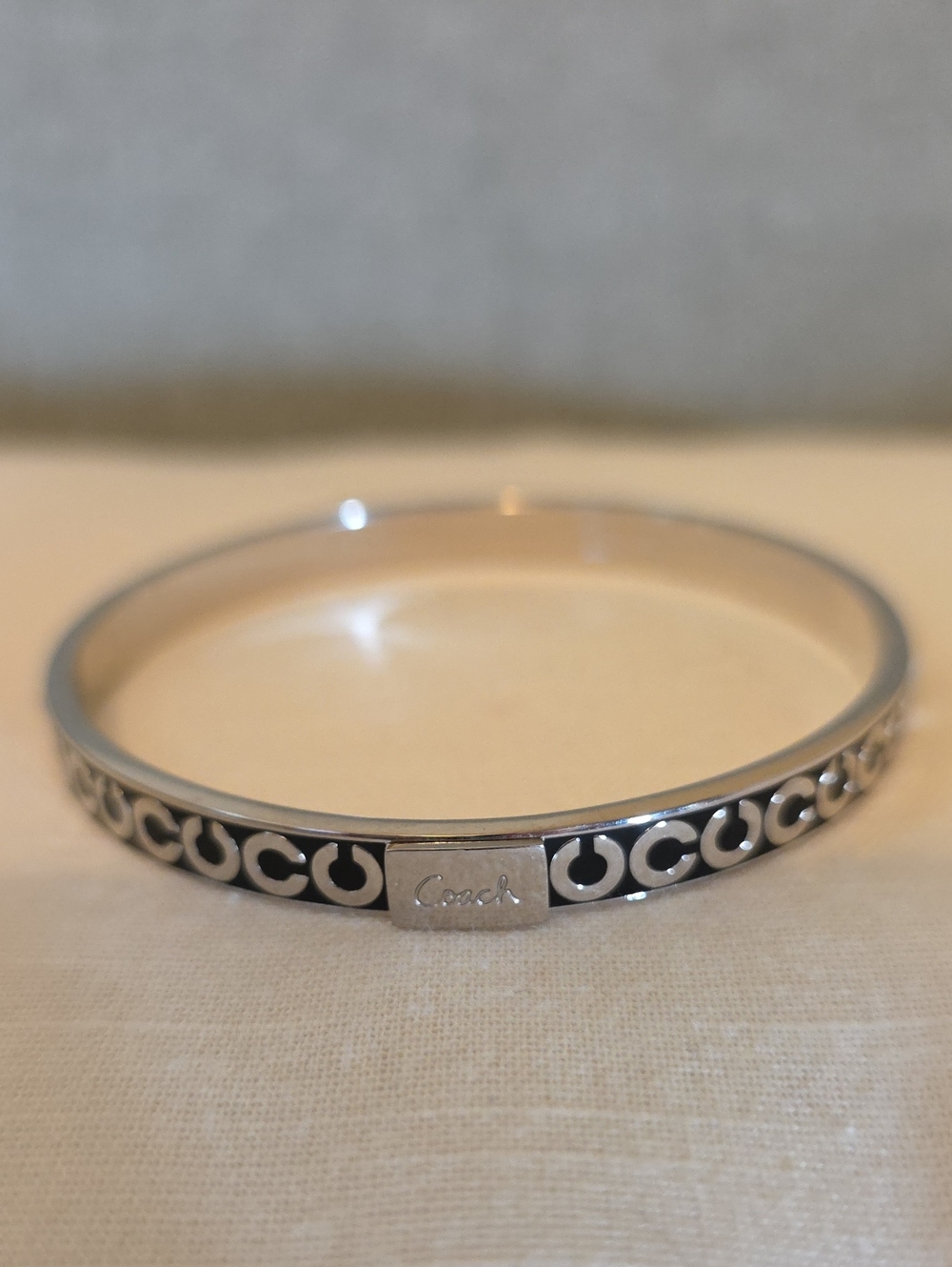 Coach Silver-Tone Bangle Bracelet with Black Inlay